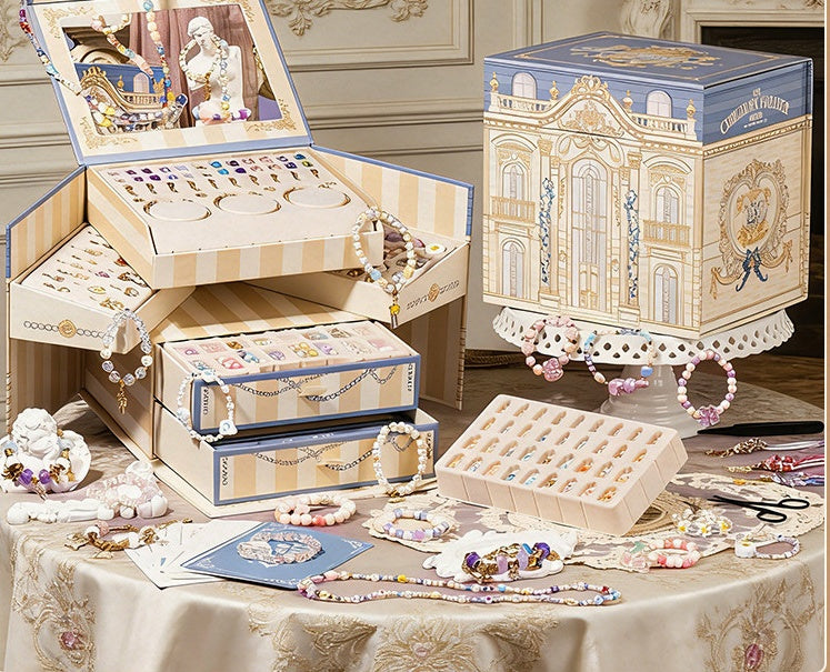 Palace jewellery box bracelet making kit shown open with mirror, trays and drawers next to the closed gift box