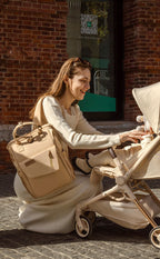 Changing bag backpack with round magnetic buckle, top handles and side pockets – view 13 of 13