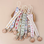 Beech Wood Dummy Clip, Embroidered Soother Holder, styled on a shelf