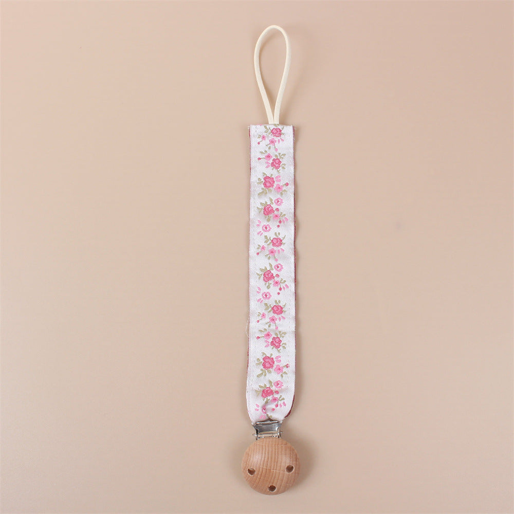 Pink Embroidered Flower embroidered dummy clip with beech wood fastening