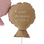 Balloon-shaped nursery cushion with an embroidered message on a nursery shelf – view 5 of 11