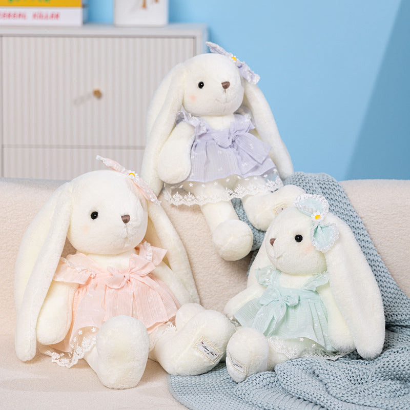 Long-eared cream bunny soft toy in a pastel dress with large bow and daisy ear accent – view 6 of 9
