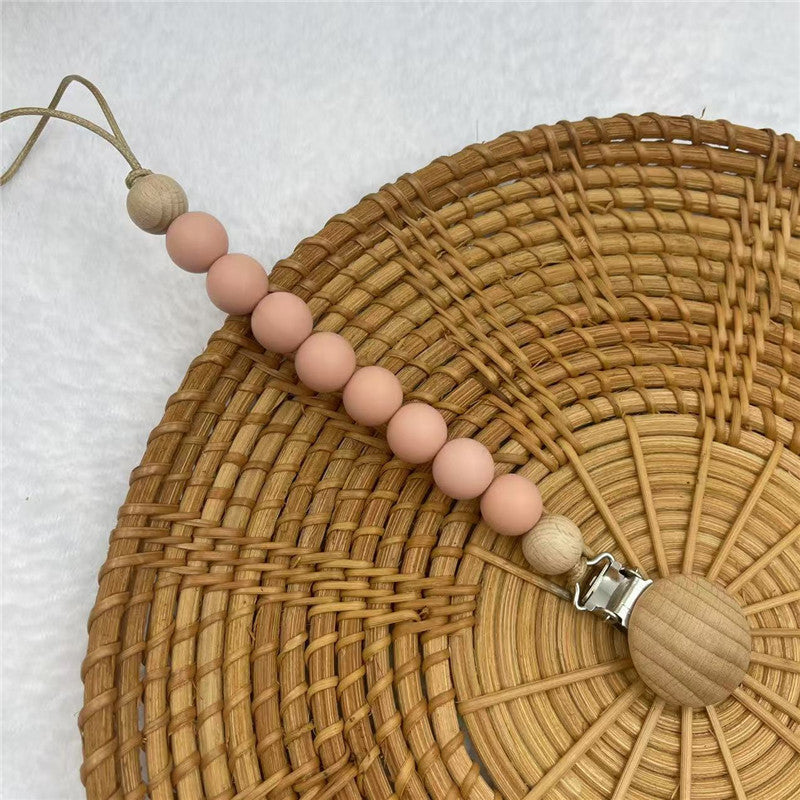Pink silicone and beech beaded dummy clip