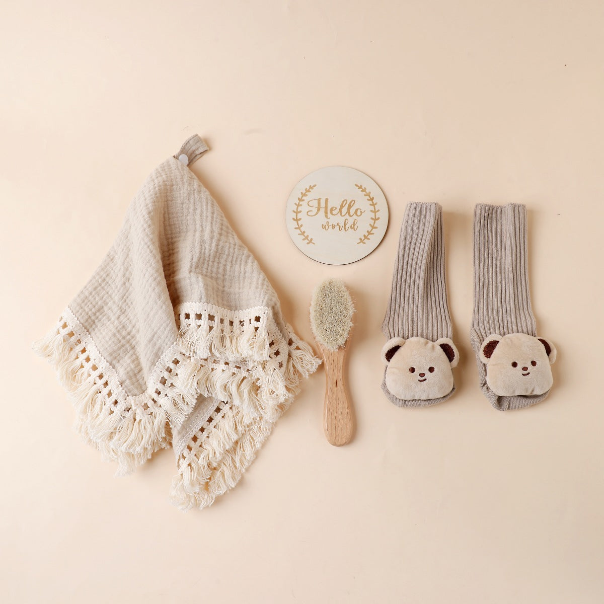 Khaki boxed newborn gift set with tassel comforter, socks and brush