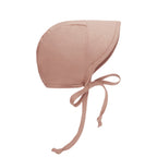 Pink baby bonnet with short brim and chin ties