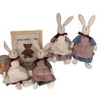 Fabric bunny doll with long ears, red neck bow, dress and apron – view 2 of 9