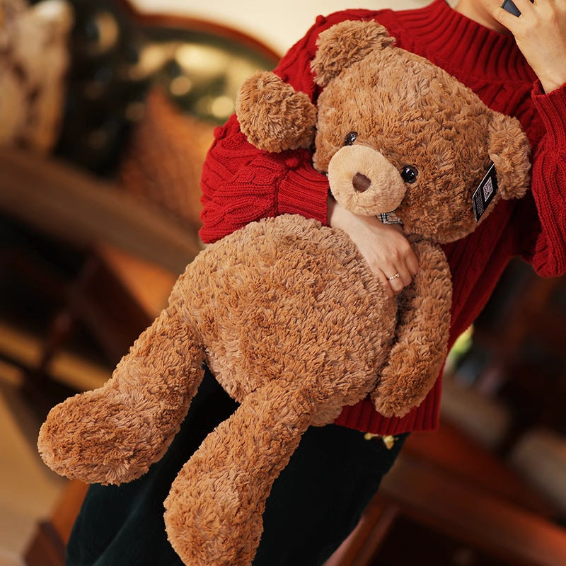Brown curly plush teddy bear with cream muzzle and checked bow tie – view 3 of 6