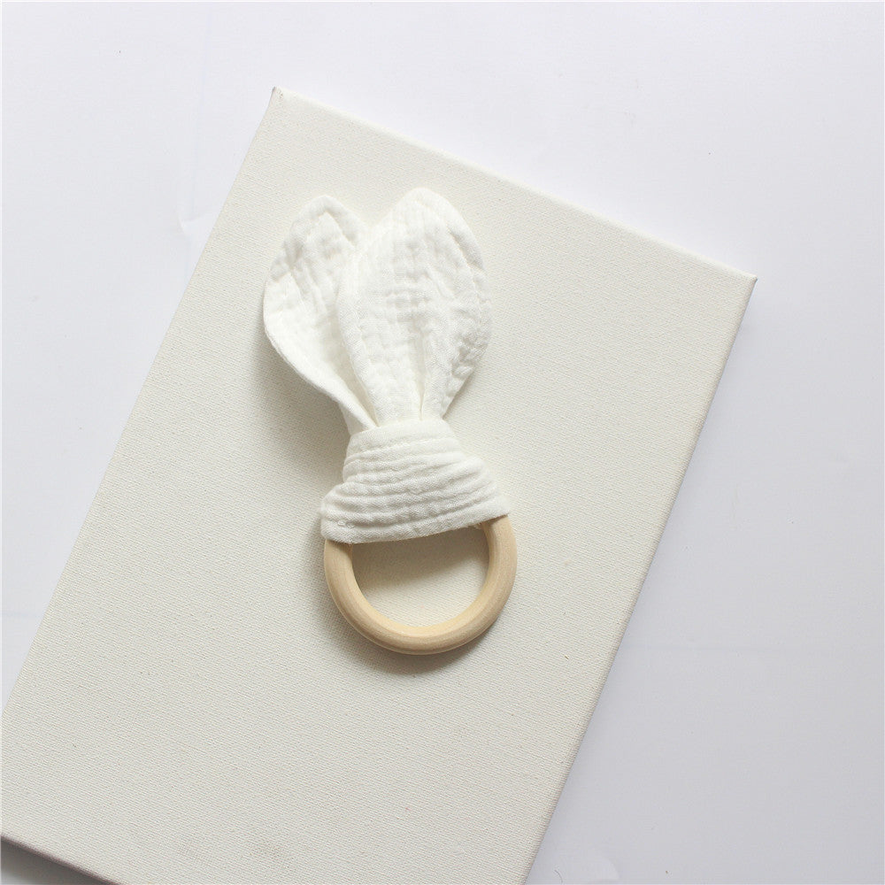 White wooden teething ring with cotton gauze bunny ears