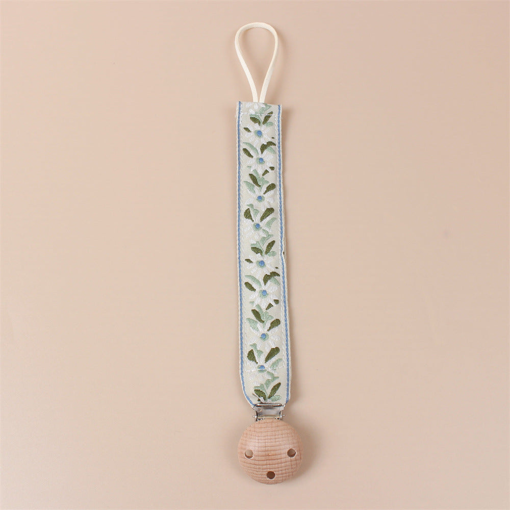Green Flower embroidered dummy clip with beech wood fastening