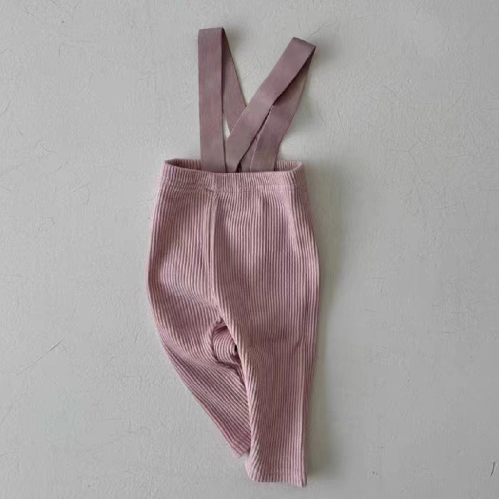 Pink ribbed cotton baby dungarees with adjustable straps