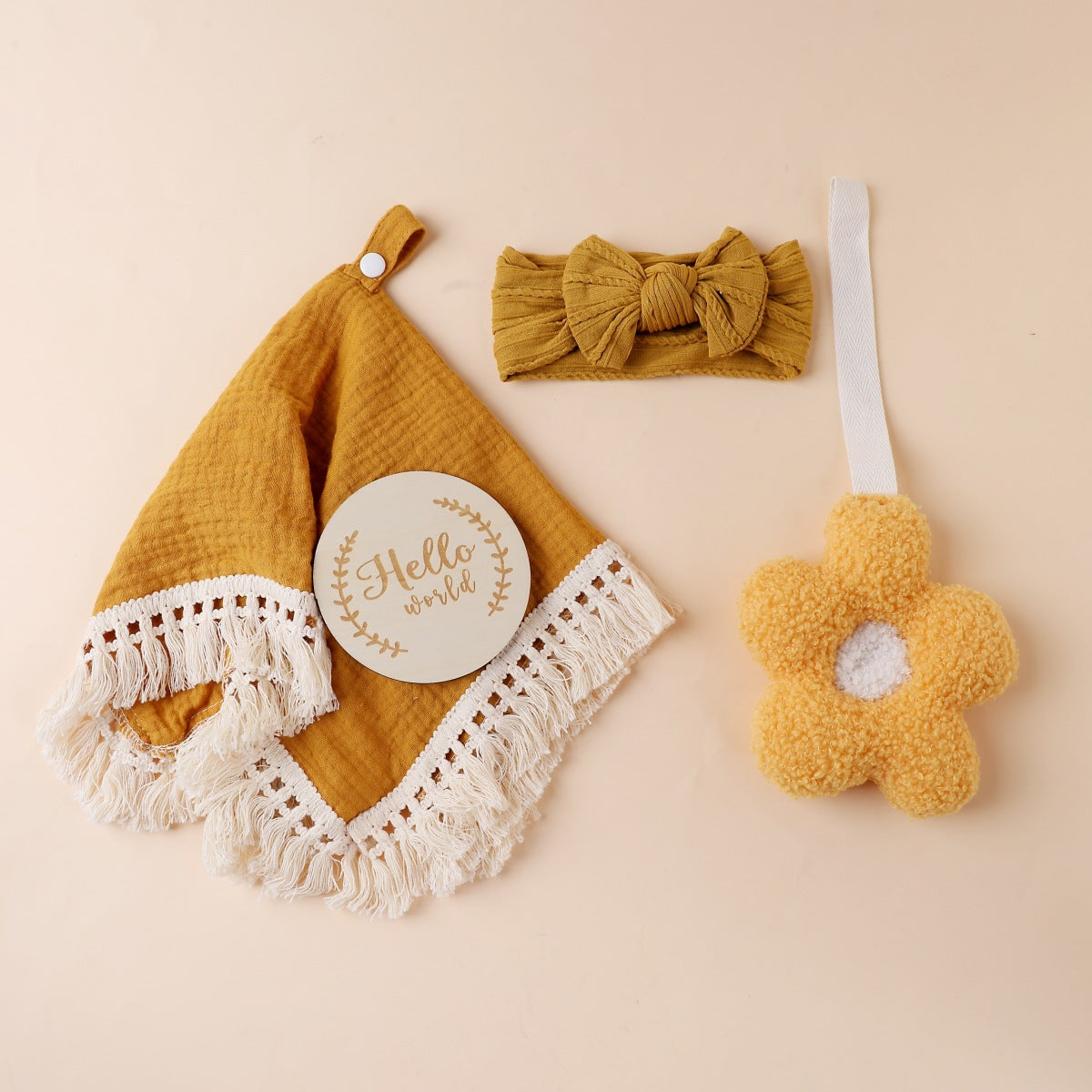 Mustard boxed newborn gift set with tassel comforter, socks and brush