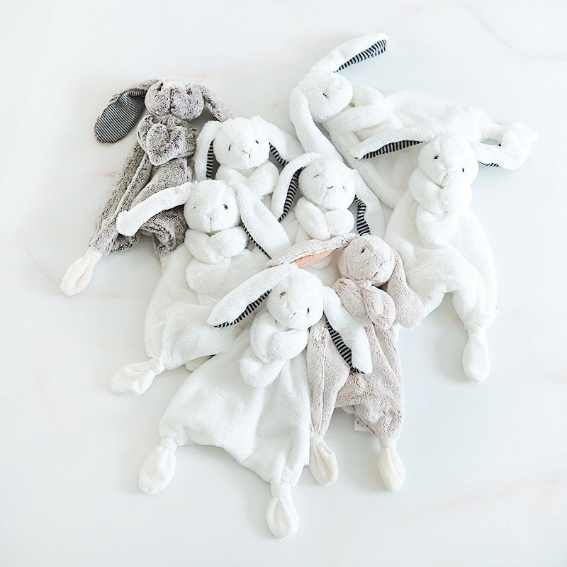 Baby comforter with plush bunny, bear or puppy head on a small comforter blanket