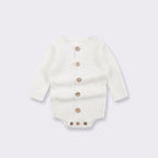 Cream knitted baby bodysuit with long sleeves and short legs