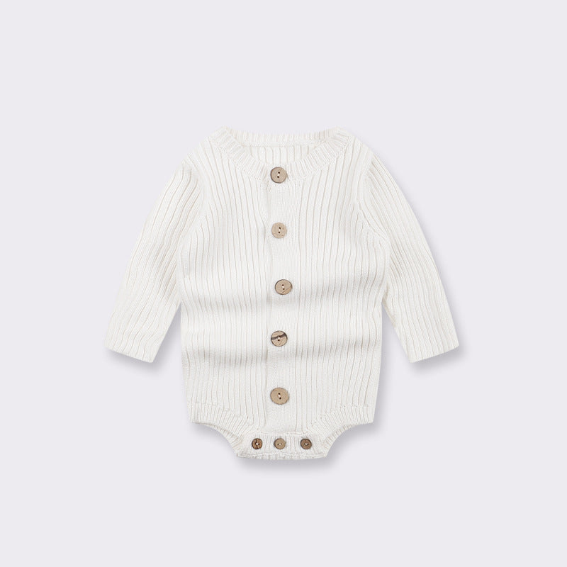 Cream knitted baby bodysuit with long sleeves and short legs