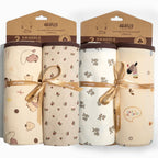 Two square printed baby wrap blankets with bound edges