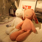 Long-limbed fabric bunny comforter doll with floppy ears and X-shaped tummy stitch – view 3 of 10