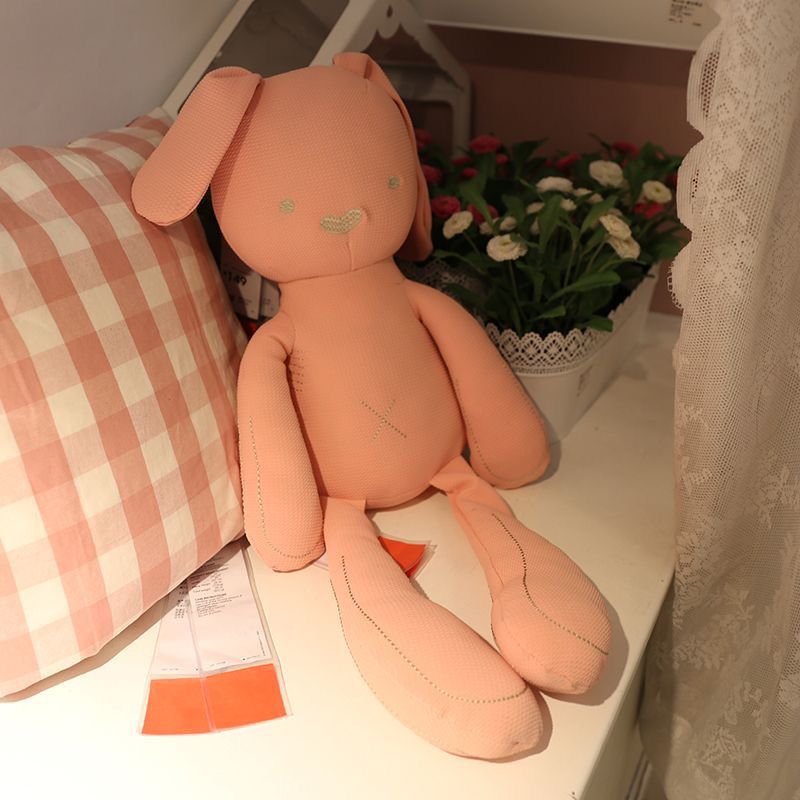 Long-limbed fabric bunny comforter doll with floppy ears and X-shaped tummy stitch – view 4 of 10