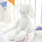 Long-limbed fabric bunny comforter doll with floppy ears and X-shaped tummy stitch – view 5 of 10