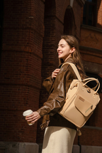 Changing bag backpack with round magnetic buckle, top handles and side pockets – view 2 of 13