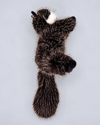 Realistic black cat plush toy, lying down, back view