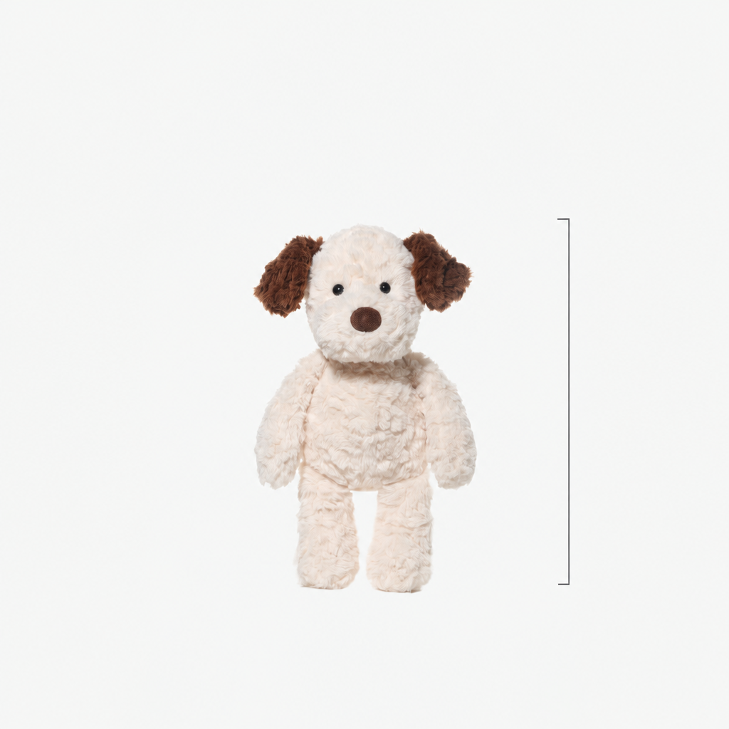 Soft plush puppy soft toy, 35 cm long, lying on a bed – view 2 of 4